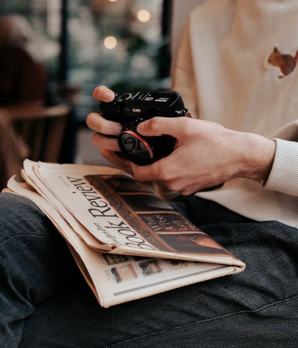 Calm person focusing on a distant point in a bright, clean room.